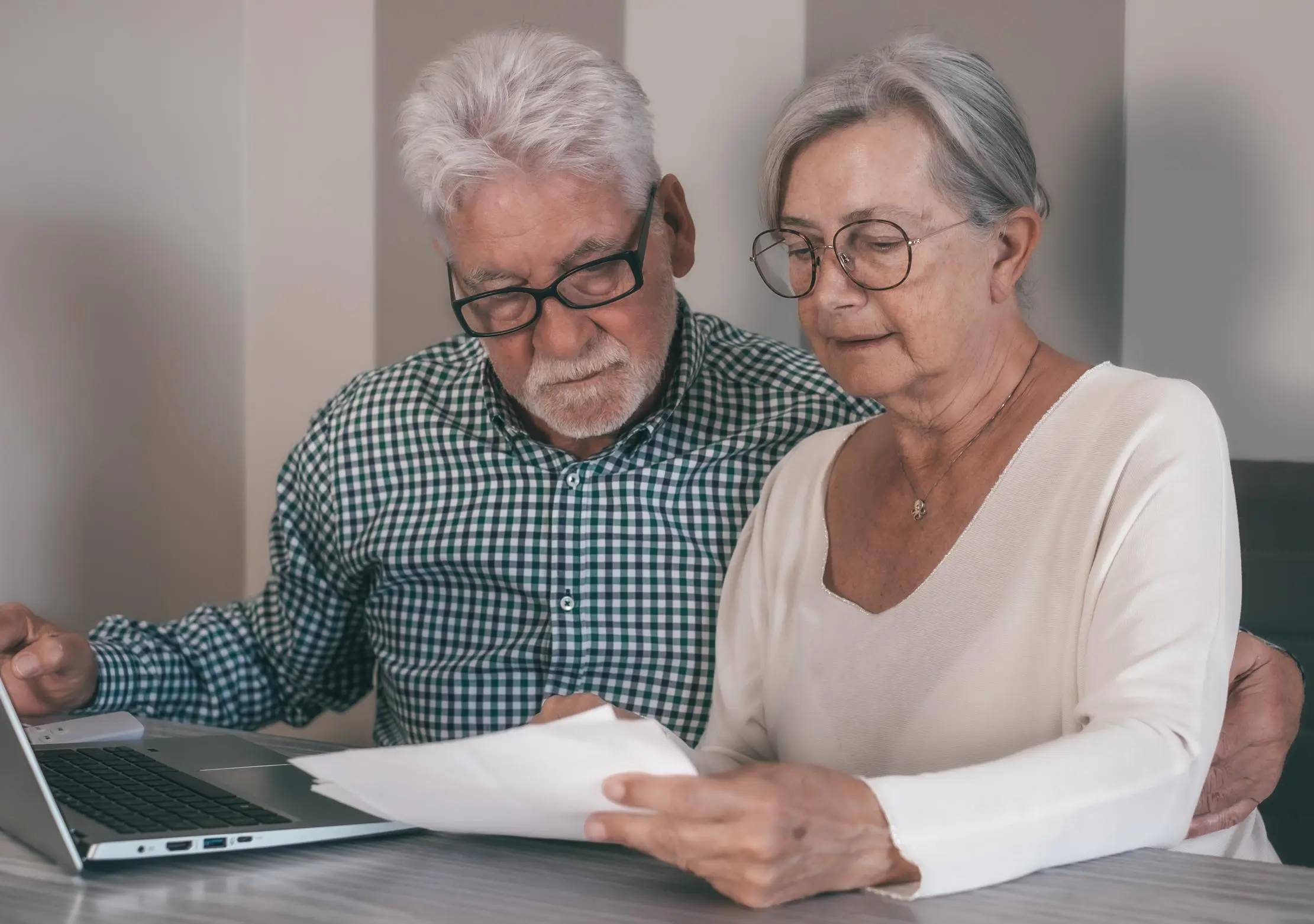Senior couple reviewing Medicare supplement insurance plans with expert support, iHealth Insurance